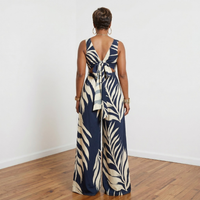Back view of Dion navy leaf print loose fit V-neck jumpsuit – House of Charlotte Boutique