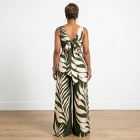 Back view of Dion olive leaf print loose fit V-neck jumpsuit – House of Charlotte Boutique