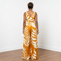 Back view of Dion deep mustard leaf print loose fit V-neck jumpsuit – House of Charlotte Boutique