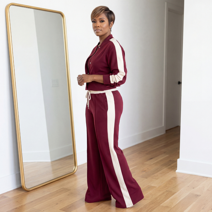 Side view of Klara woven burgundy and cream two-piece set with flared pants and stretch fabric
