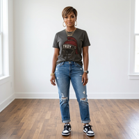 African American woman wearing the Trojan Game Day Tee in charcoal with cuffed distressed jeans and black and white sneakers