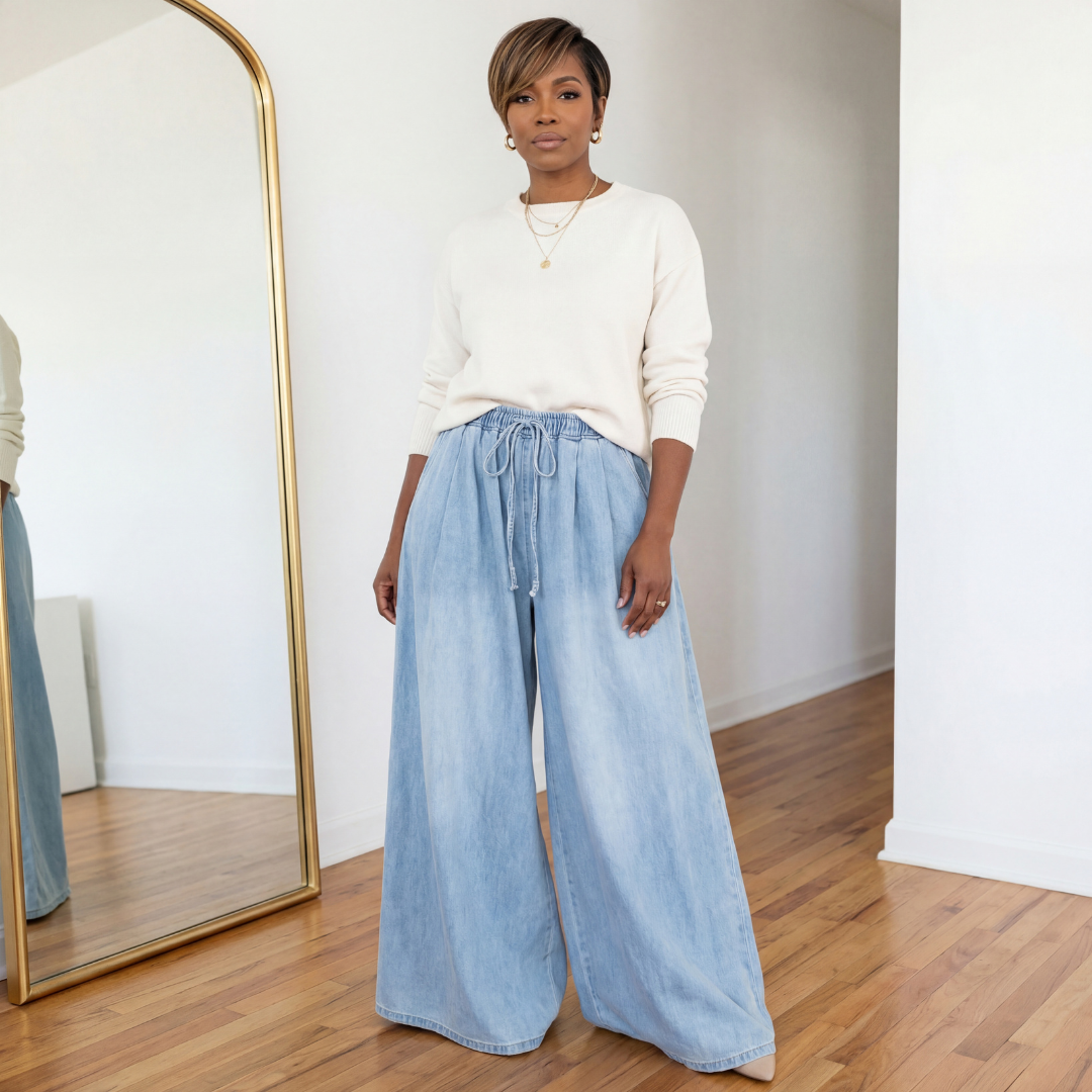 Celeste wide leg denim gauchos in light denim featuring an elastic waist and flowy gaucho silhouette, styled with an off-white sweater