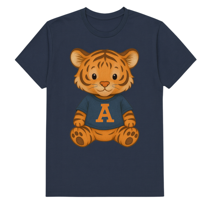 A navy blue short-sleeve crewneck t-shirt featuring a cartoon graphic of a smiling orange tiger cub wearing a navy blue shirt with a large orange letter 'A' on the chest, set against a plain white background.