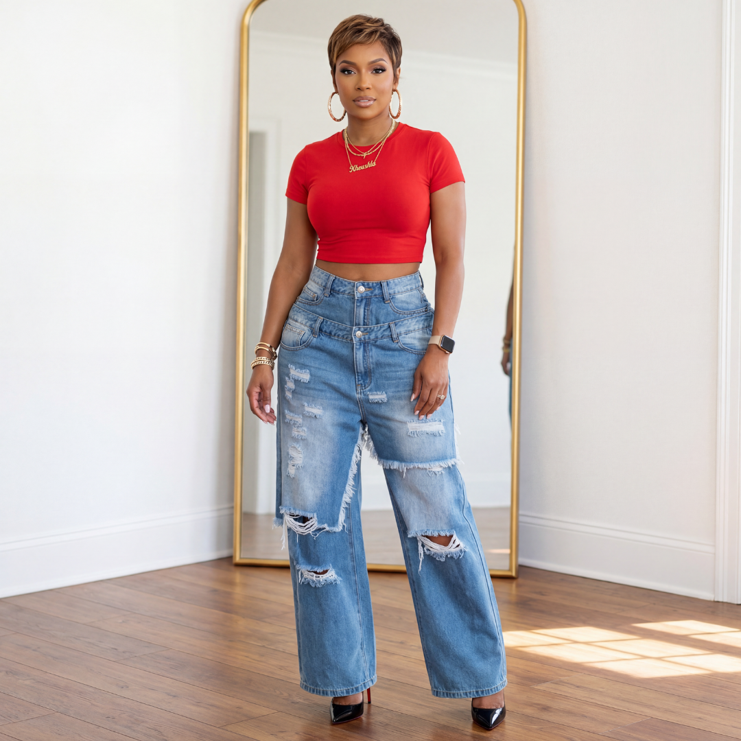Model wearing Estelle distressed double layer wide leg jeans with red cropped tee and black heels