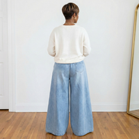 Back view of Celeste wide leg denim gauchos in light denim showing the dramatic wide-leg fit and single back pocket