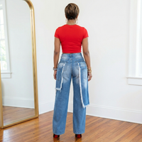 Back view of Estelle double layer distressed wide leg jeans with structured silhouette