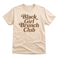 Woman wearing Black Girl Brunch Club sand graphic t-shirt with skinny jeans and brown white sneakers