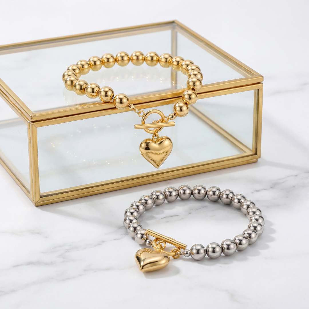 Heart charm beaded bracelet in gold and mixed metal with polished 8mm beads and statement heart pendant