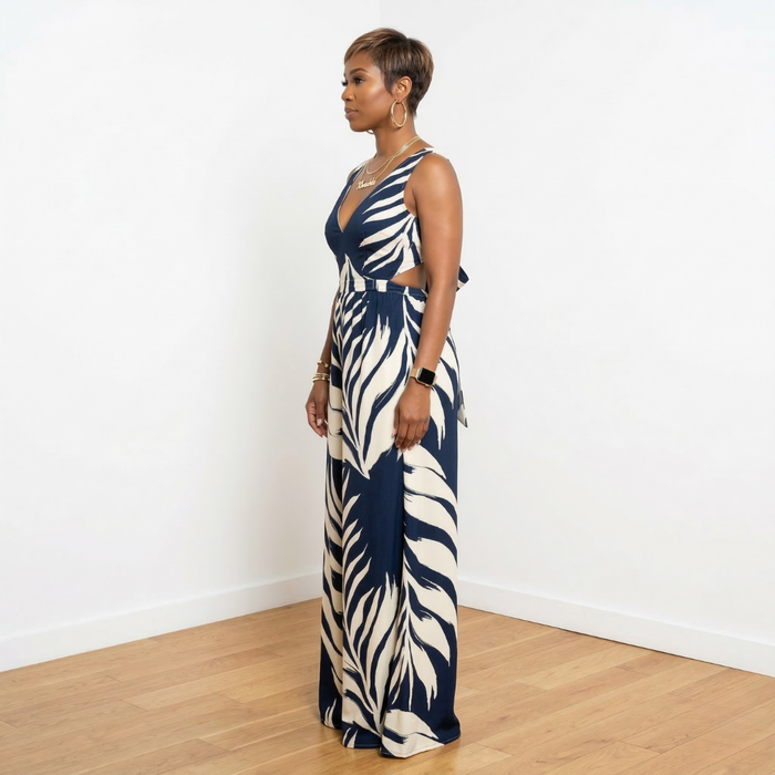Side view of Dion navy leaf print V-neck loose fit jumpsuit – House of Charlotte Boutique