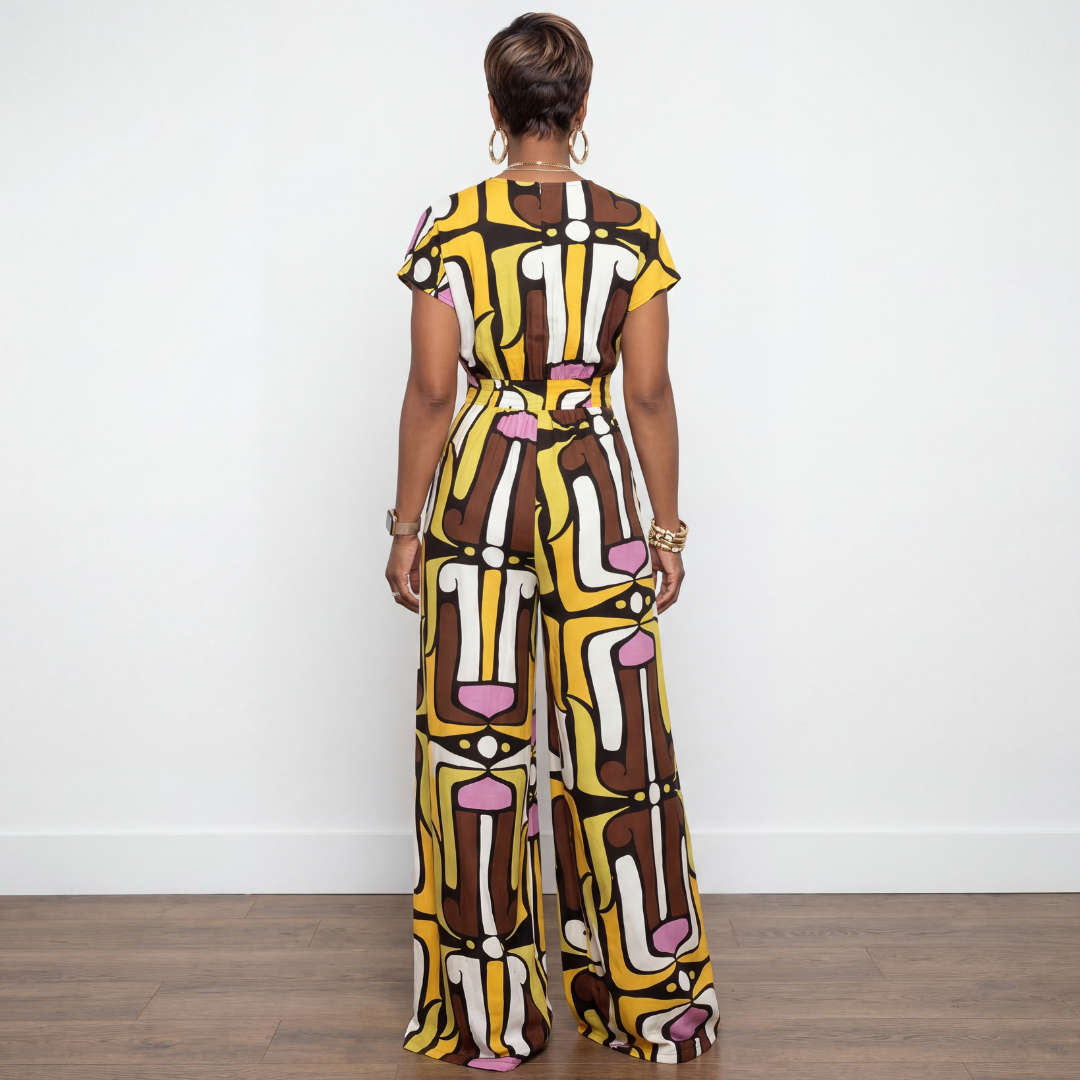 Back view of Melanie brown and mustard multi print button down wide-leg jumpsuit – House of Charlotte Boutique
