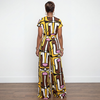 Back view of Melanie brown and mustard multi print button down wide-leg jumpsuit – House of Charlotte Boutique